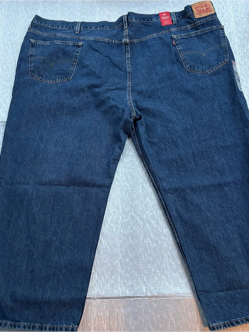 NWT Levi's 550’s with a 63W x 30L relaxed fit.